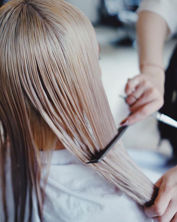 Soft blonde balayage combed through after a color appointment